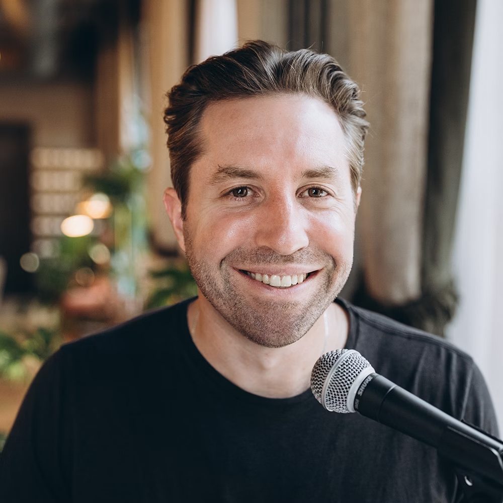 Rob Cressy speaking into a microphone